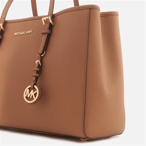 michael michael kors jet set travel leather tote bag luggage|Michael Kors bag with airplanes.